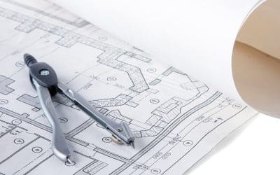 Architectural plans compass and ruler on the desk